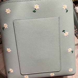 Darcy Daisy Bucket Small kate spade Crossbody purse and matching wallet.